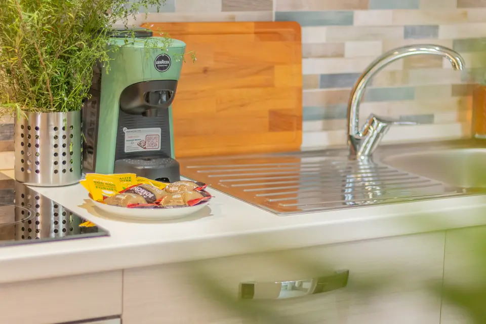 Coffee corner with a Lavazza machine and rosemary